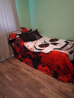 Twin bed with mattress and bedding