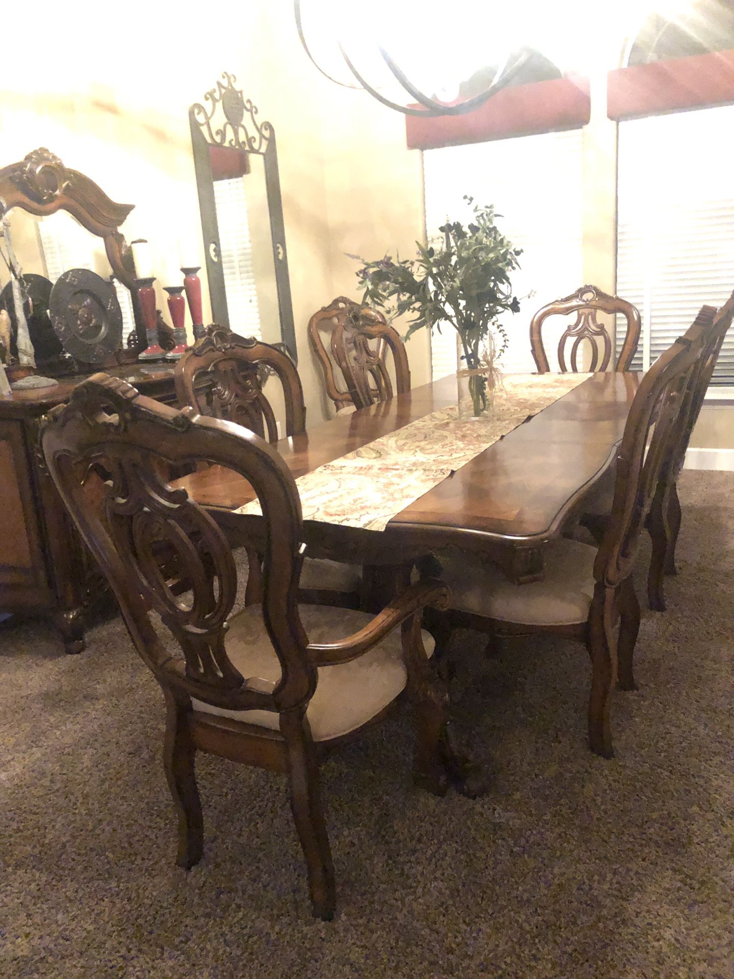 Dinning Room Table with 2 leaves, 8 chairs and beautiful buffet. Like new, no scratches or stains. Table seats 8 comfortably and we have had up to 12
