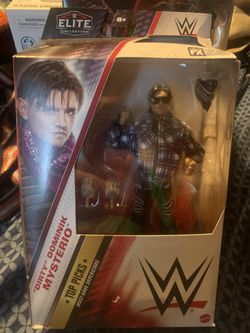 WWE Elite Top Picks Dirty Dominik Mysterio . Packaging Has Damage As Shown . Figure Not Affected 