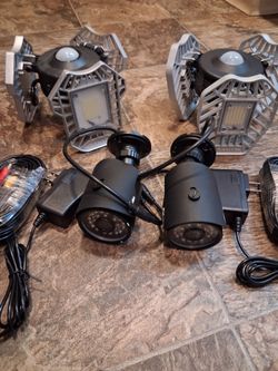 Two security cameras W/2 LED motion lights