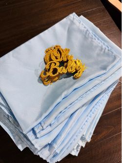 48 baby blue napkins and 11 oh baby gold letters