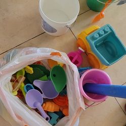 Kids beach toys and 4 floating and 1 Octopus bubble machine and 2 swimming suit 