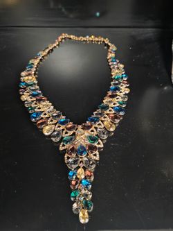 Multicolored rhinestone necklace has minor blemish but selling cheap at $30 due to that blemish, was $50