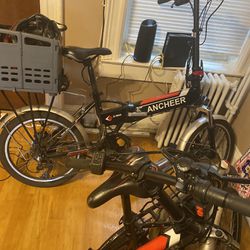 Two E-Bikes And Two Helmets
