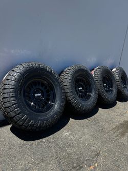 Method MR318 6x5.5 17” Gloss Black Wheels with 35” Nitto RidgeGrappler Tires CHEVY GMC TOYOTA