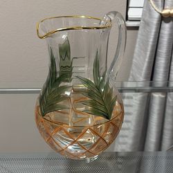 Glass pitcher with palm leaf design
