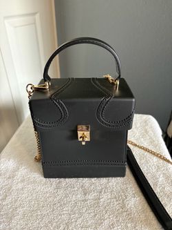 Black and gold rubber handbag