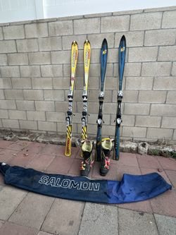 Snowboards And Skis With Boots And Bags 