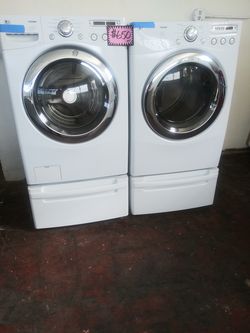 LG front load washer and dryer set with pedestals working perfectly
