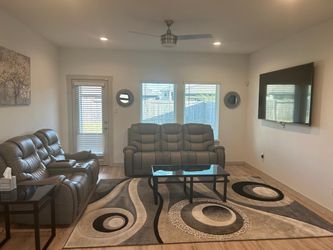 2 piece leather recliner sofa set with big rug