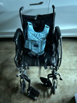 Secure vest for transport of individual in transport.