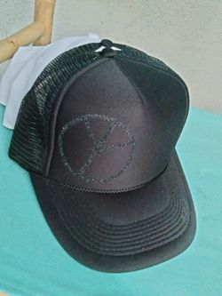 pEaCe SiGn 
NBRHD  cAp/hat 