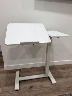 Adjustable over bed side table . Computer desk