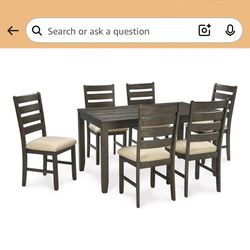 Signature Design by Ashley Rokane 7-Piece Dining Room Table Set with 6 Upholstered Chairs - Brown Wood 20" Rectangular Table & Chair Set for Kitchen D
