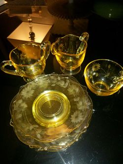 Yellow Lancaster Depression Glass peices...5 saucers 1 cup cream and sugar set...perfect condition!!