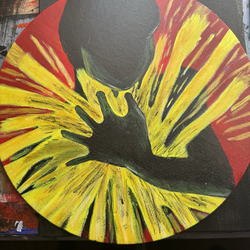 Figure with Exploding Yellow Energy