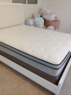 Queen bed with pillow top mattress