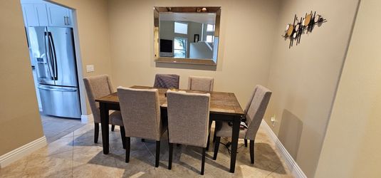 Dining 7 piece set:
Beautiful dark brown 7 piece dining table with beautiful beige colored fabric cushion seats on sale for only $799.99 moving SALES!
