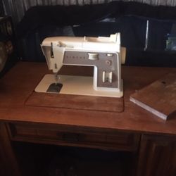 1960’s era Singer sewing machine and desk/cabinet