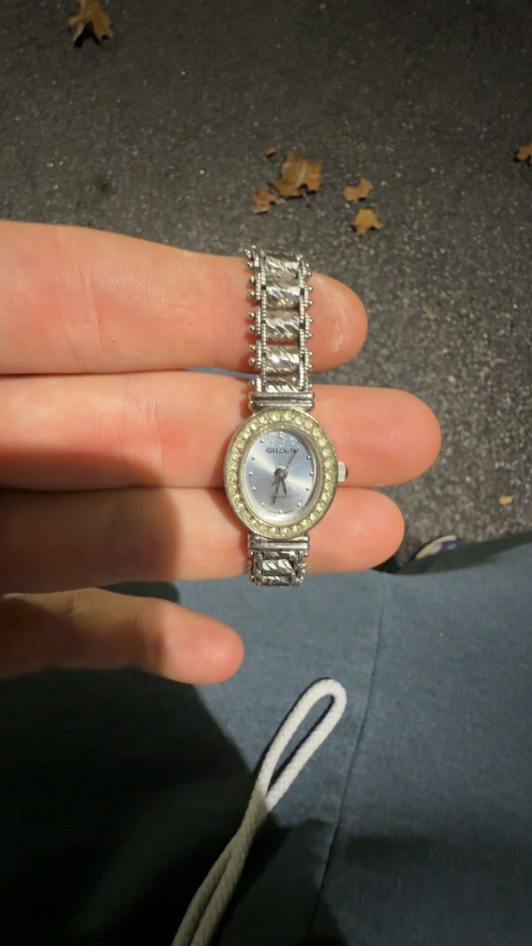 Gruen ladies' wristwatch, likely model GR7209, featuring a silver-tone finish and rhinestone-accented beze