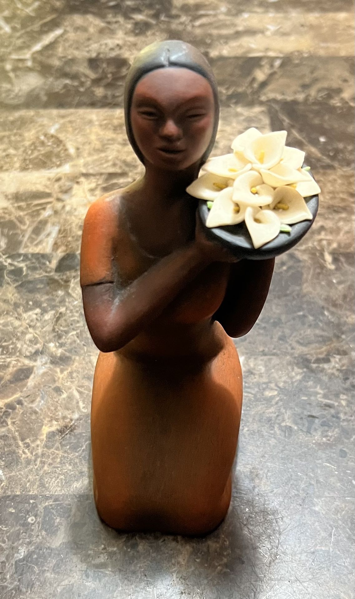 Ceramic Woman kneeling with Cala Lillies.
