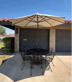 Patio set. Table and chairs. Umbrella and stand. Very nice condition.