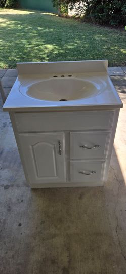 Bathroom sink and cabinet