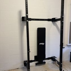 PRx Fold-IN ONE Weight Rack  w/ Spotter Arms & Folding Wall Mounted Bench