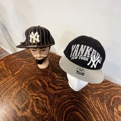 A pair of vintage New York Yankees baseball caps with original sale stickers will not separate  Made by twins enterprise .