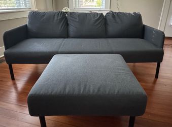 Dark gray sofa and ottoman