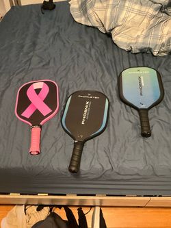 Pickle ball paddles 2 are barely used and 2 are brand new