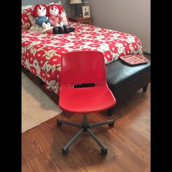 Red Swivel Chair On Wheel