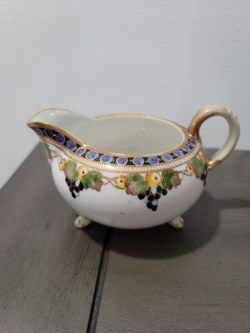 Nippon hand painted sugar bowl and creamer set