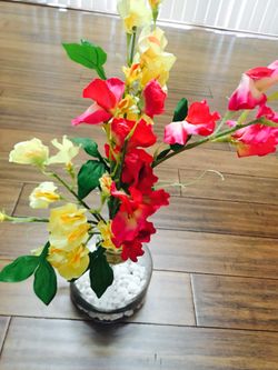 Glass flower vase with yellow and pink flowers $35