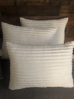 3 White decorative pillows