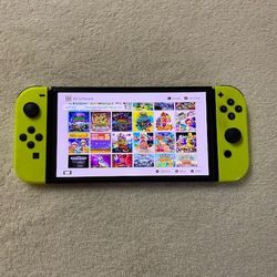 NINTENDO SWITCH OLED + 125 SWITCH GAMES