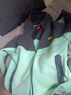 Blue and green Nike tec