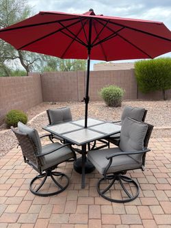 Table chairs and umbrella