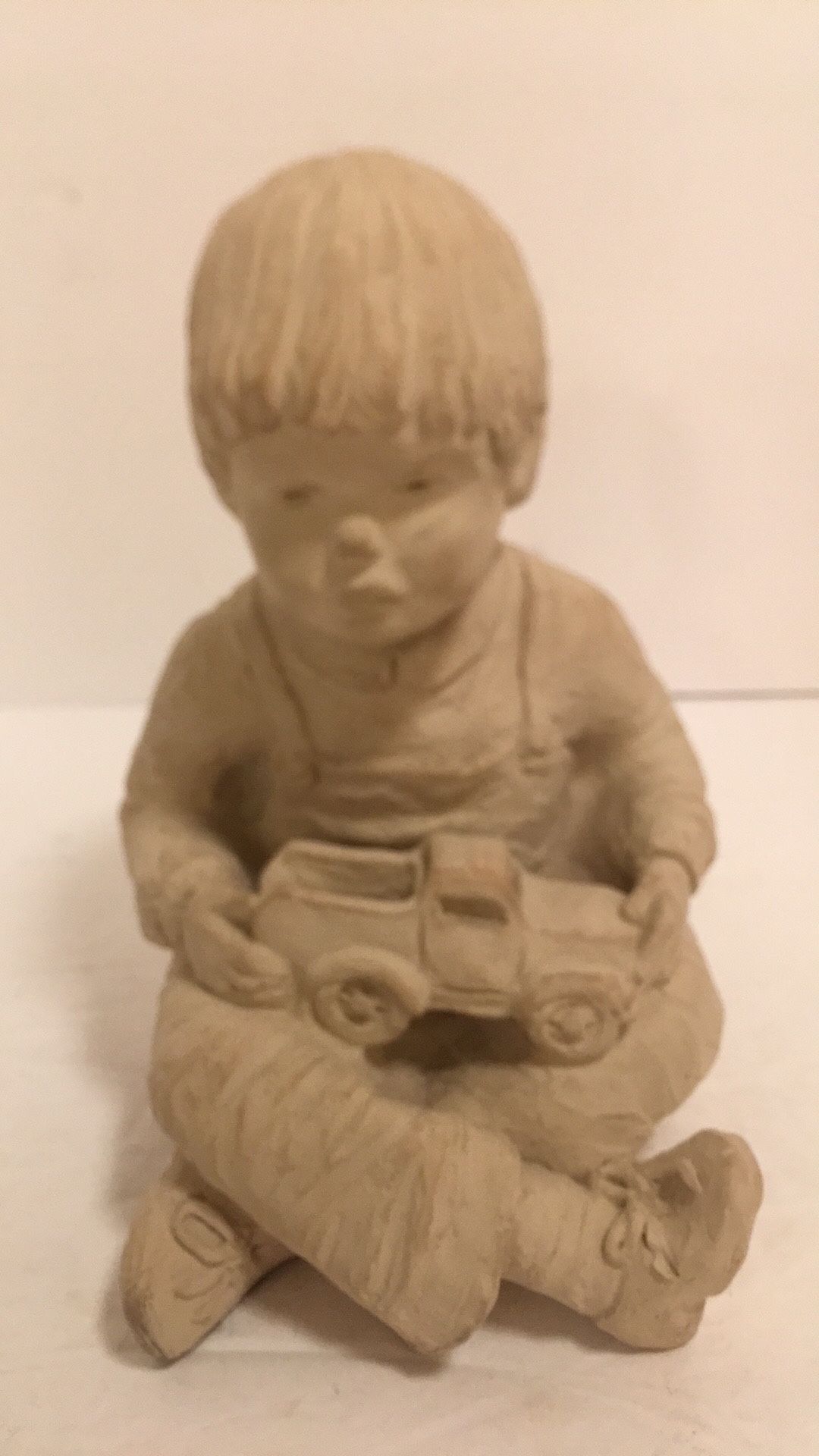 Vintage (1985) Bright Eyes Sculpture By Dee Crowley Austin Prod. 1985 Boy w/ Toy Car in excellent condition made of Alabaster