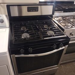 Black and Stainless Steel Four  Burner Working Perfect Condition 