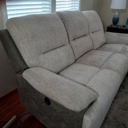 Sofa with recliners on each end. 
