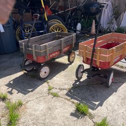 Two radio flyer, wagons, and twin Traxel bike aluminum