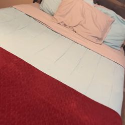 Gray Diamond studded bed frame with mattress and box spring