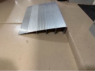 Ramp for wheel chair etc… Alum adjustable 5 tier w/ interlocking sections.