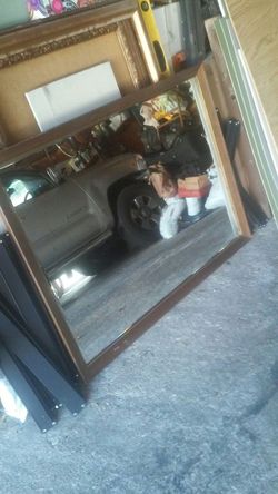 Framed mirror. Beveled edges.