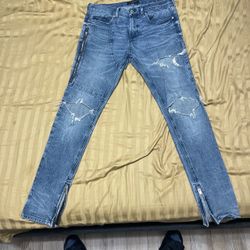 Light blue ripped jeans
