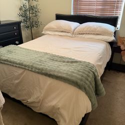 Queen Bedroom Set. Black Bed (Frame And Headboard), 6 Drawer Dresser With Mirror and 2 Drawer Night Stand. The Nightstand Has A Small Blemish.