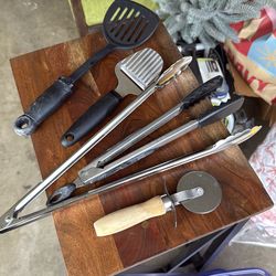 Cheese shaver, pizza cutter, and stainless steel tongs