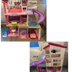 Barbie dream house with lots of Barbies,clothing & accessories