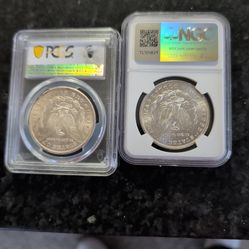 1878 Morgan CC mint PCGS graded MS 63 and on nfc secure  holder.. And  1887 ms63 ngc